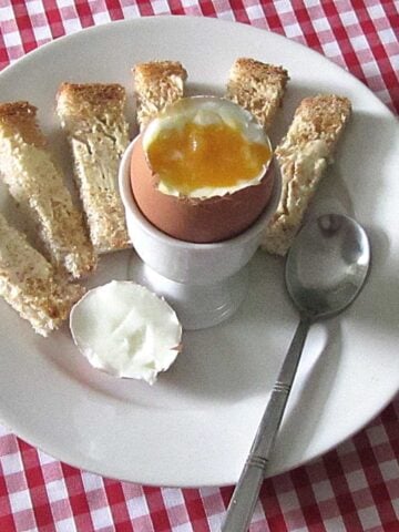 Learn how to bowl an egg to reach the perfect yolk consistency for dunking bread ladders into the soft centre.