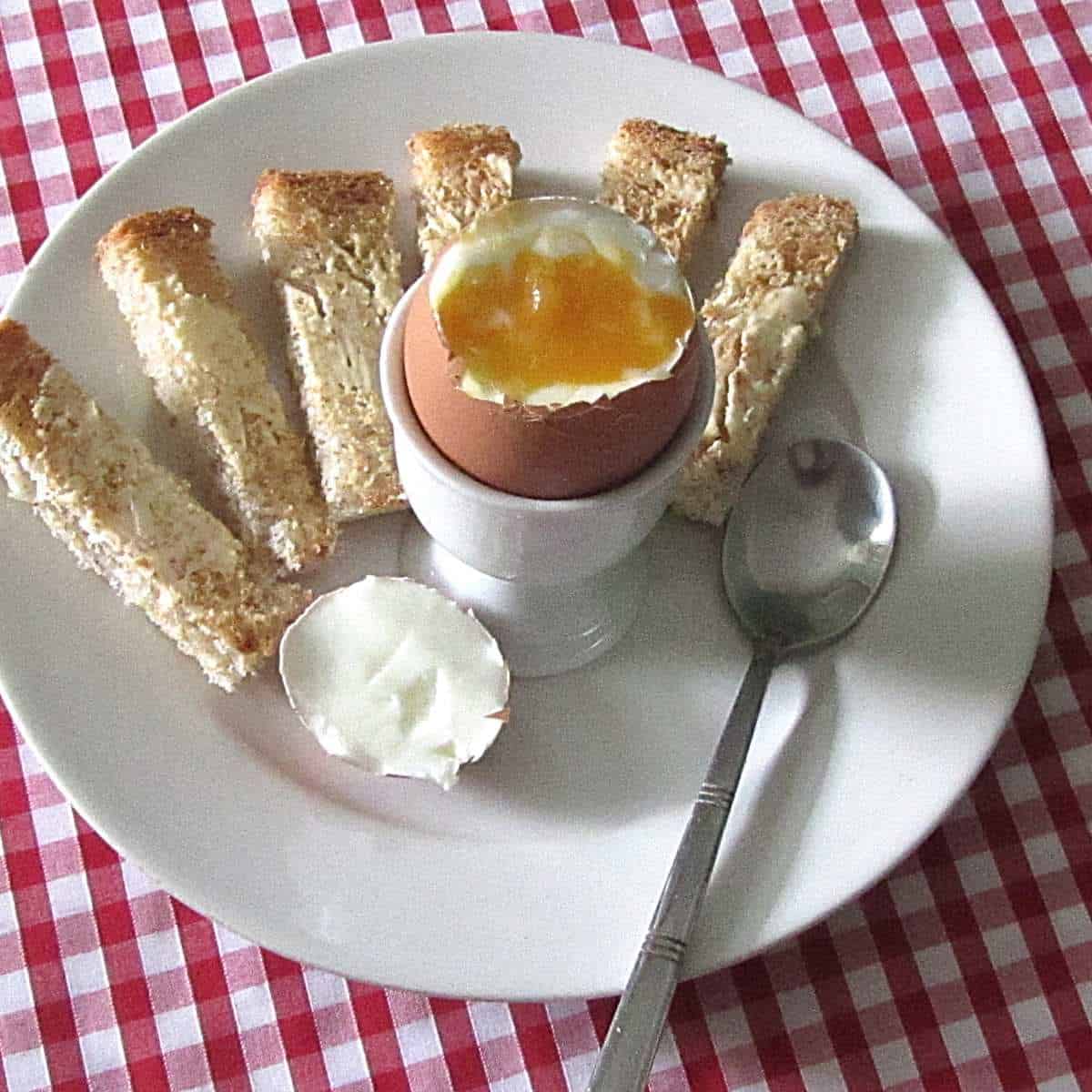 Learn how to bowl an egg to reach the perfect yolk consistency for dunking bread ladders into the soft centre.