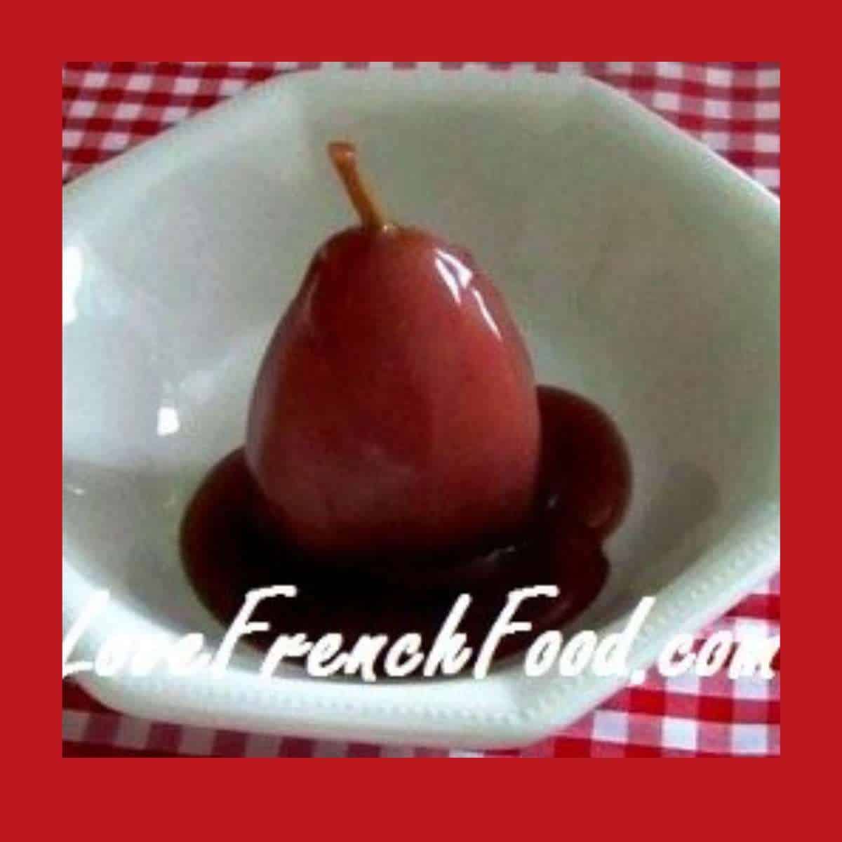 Piece of fruit covered in red sauce in white bowl on red and white cloth.