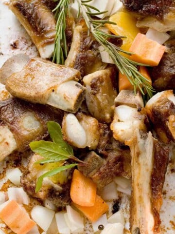 Veal bones with bits, carrots, onions, and herbs.