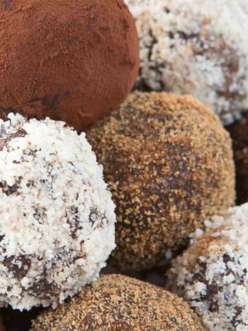 Chocolate truffles coated in cocoa, coconut, and chopped nuts