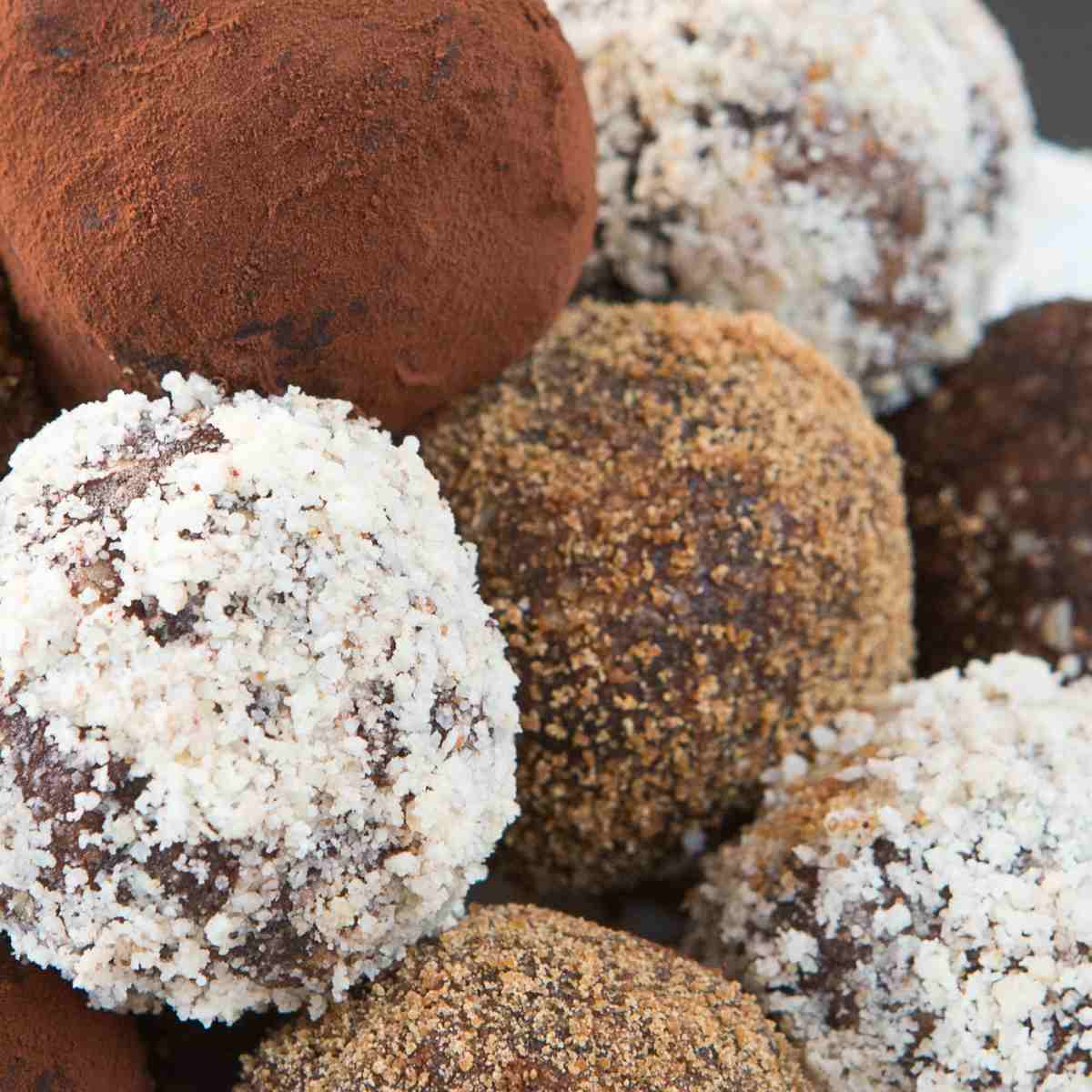 Chocolate truffles coated in cocoa, coconut, and chopped nuts