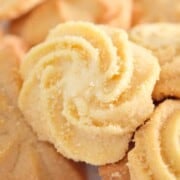 White swirl shaped cookies, sprinkled with sugar.