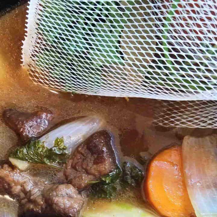 All ingredients in the pot with the bouquet garni to cook.