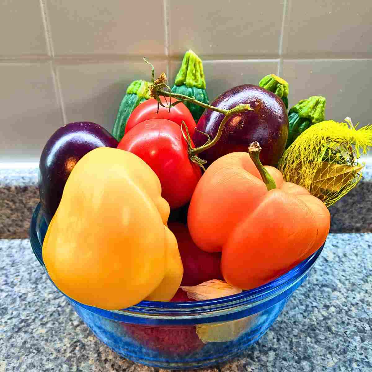 Colorful-vegetables in a blue glass bowl.