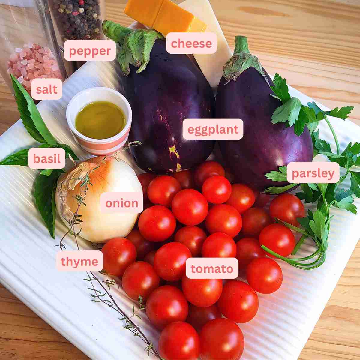 Picture of all the ingredients for eggplant cheese bake with labels.