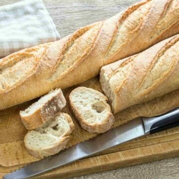 Baguette loaves sliced and ready for butter.