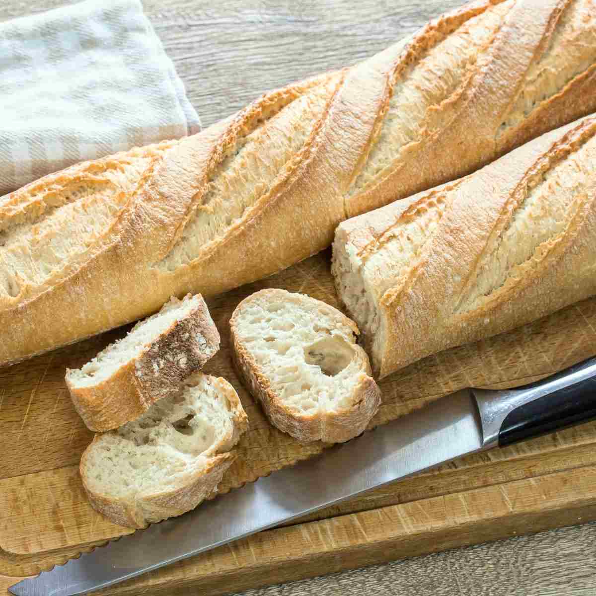 Baguette loaves sliced and ready for butter.