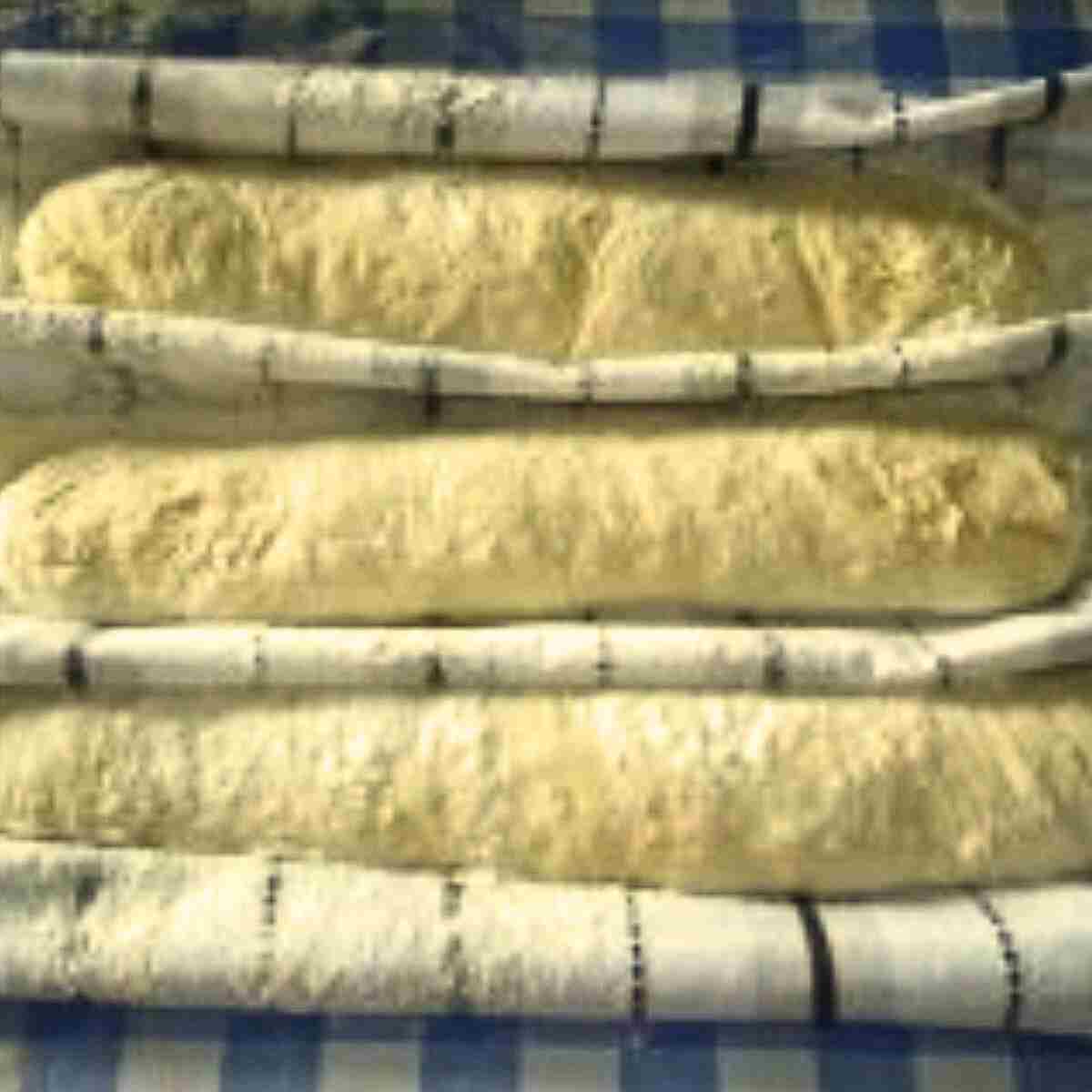 Letting baguettes rise in towels to hold shape.
