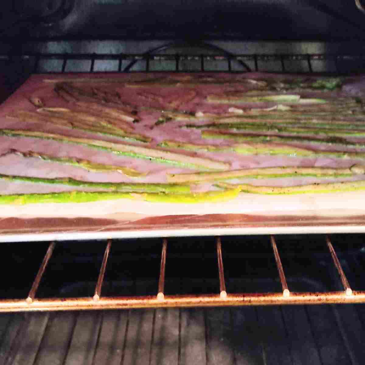 Shaved asparagus roasting in the oven.