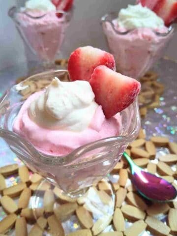 Luscious and rich creme fraiche on top of strawberry mousse and fresh strawberries.