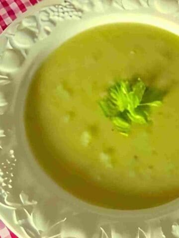 A light, nourishing soup with celery stalks, leaves, onions, potatoes, milk, and cream.