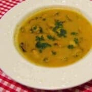 Classic mussel soup is made with fresh mussels, tomatoes, garlic, parsley, butter, and white wine.