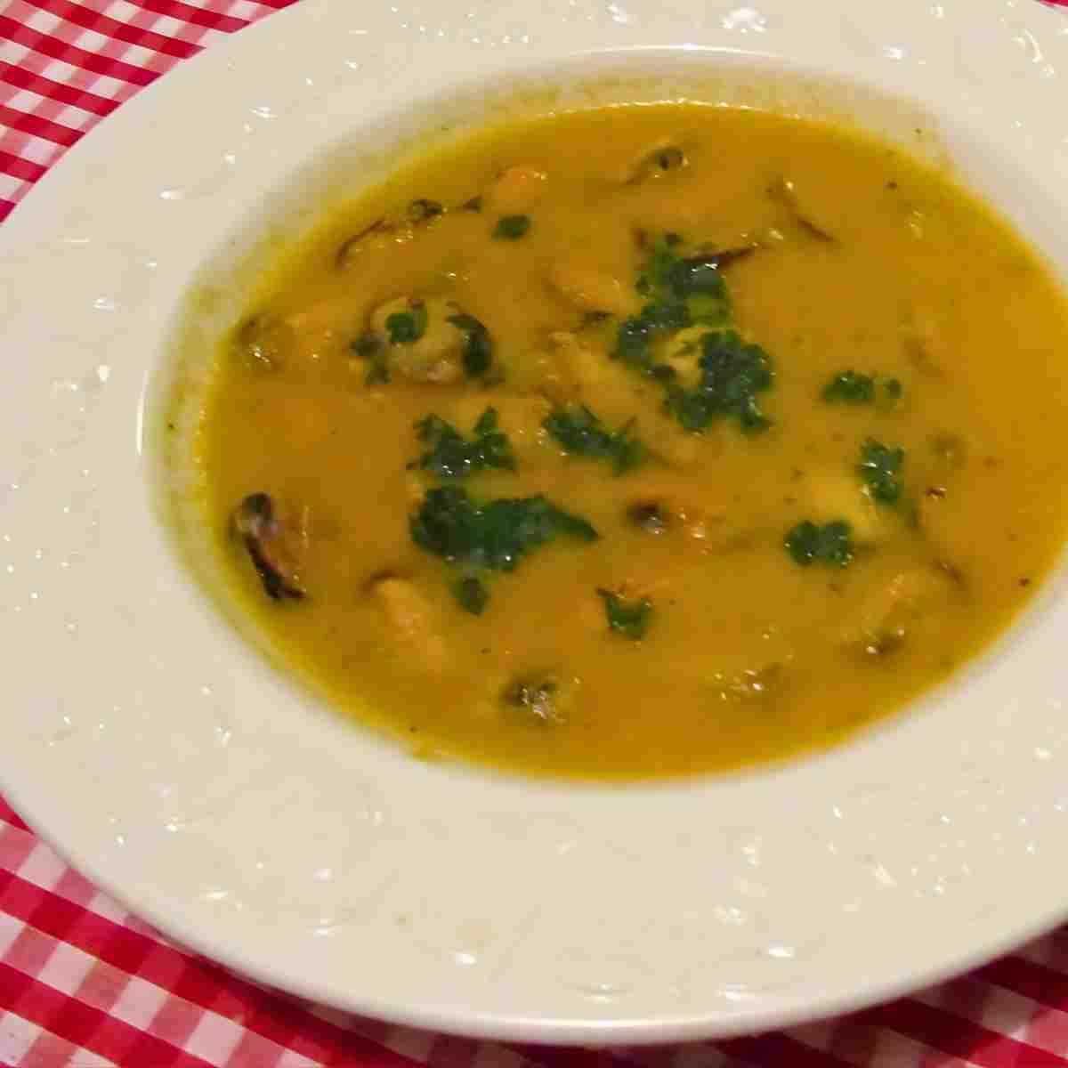 Classic mussel soup is made with fresh mussels, tomatoes, garlic, parsley, butter, and white wine.