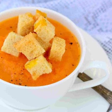 French pumpkin soup with cheesy croutons and grated pepper.