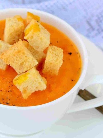French pumpkin soup with cheesy croutons and grated pepper.