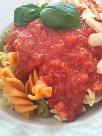 A delicious bowl of easy French basic, fresh tomato sauce made with vegetables and bouquet garni, served on pasta.
