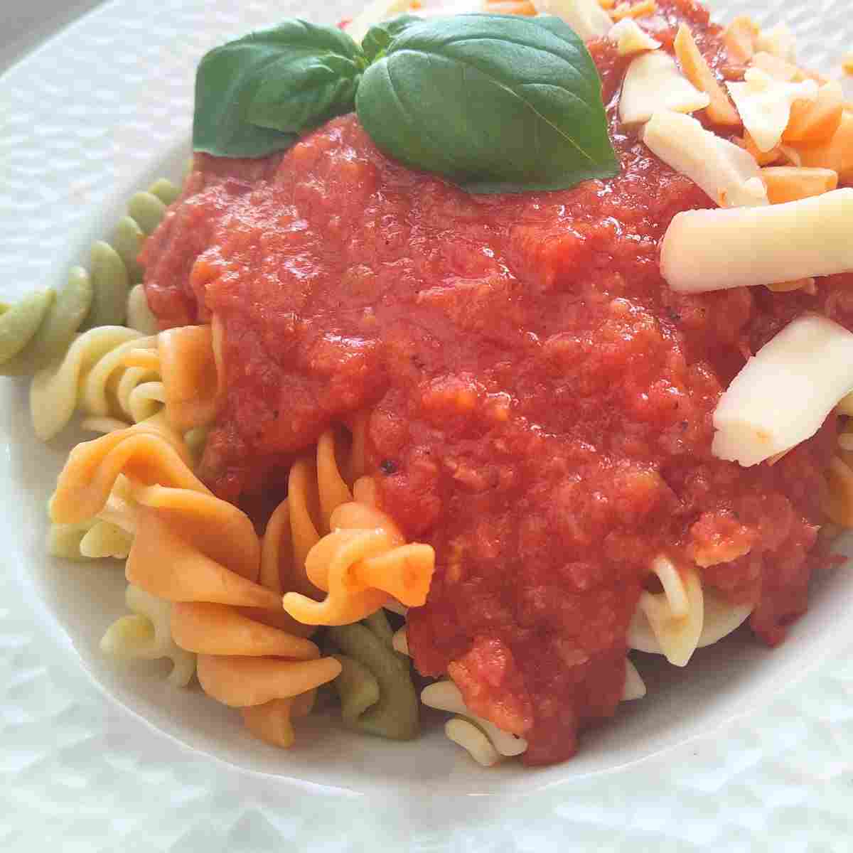 A delicious bowl of easy French basic, fresh tomato sauce made with vegetables and bouquet garni, served on pasta.