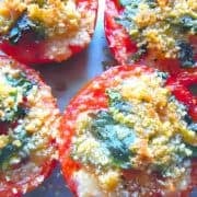 Photo of quick and easy oven roasted tomatoes sprinkled with herbs and cheese.