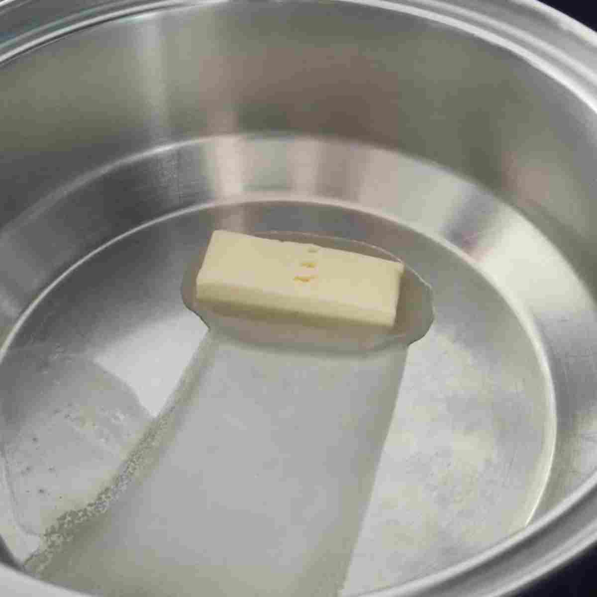 Melting butter in a pan large enough for all the ingredients,