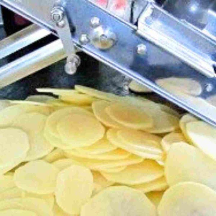 Potatoes evenly sliced with a mandolin for French gratin.
