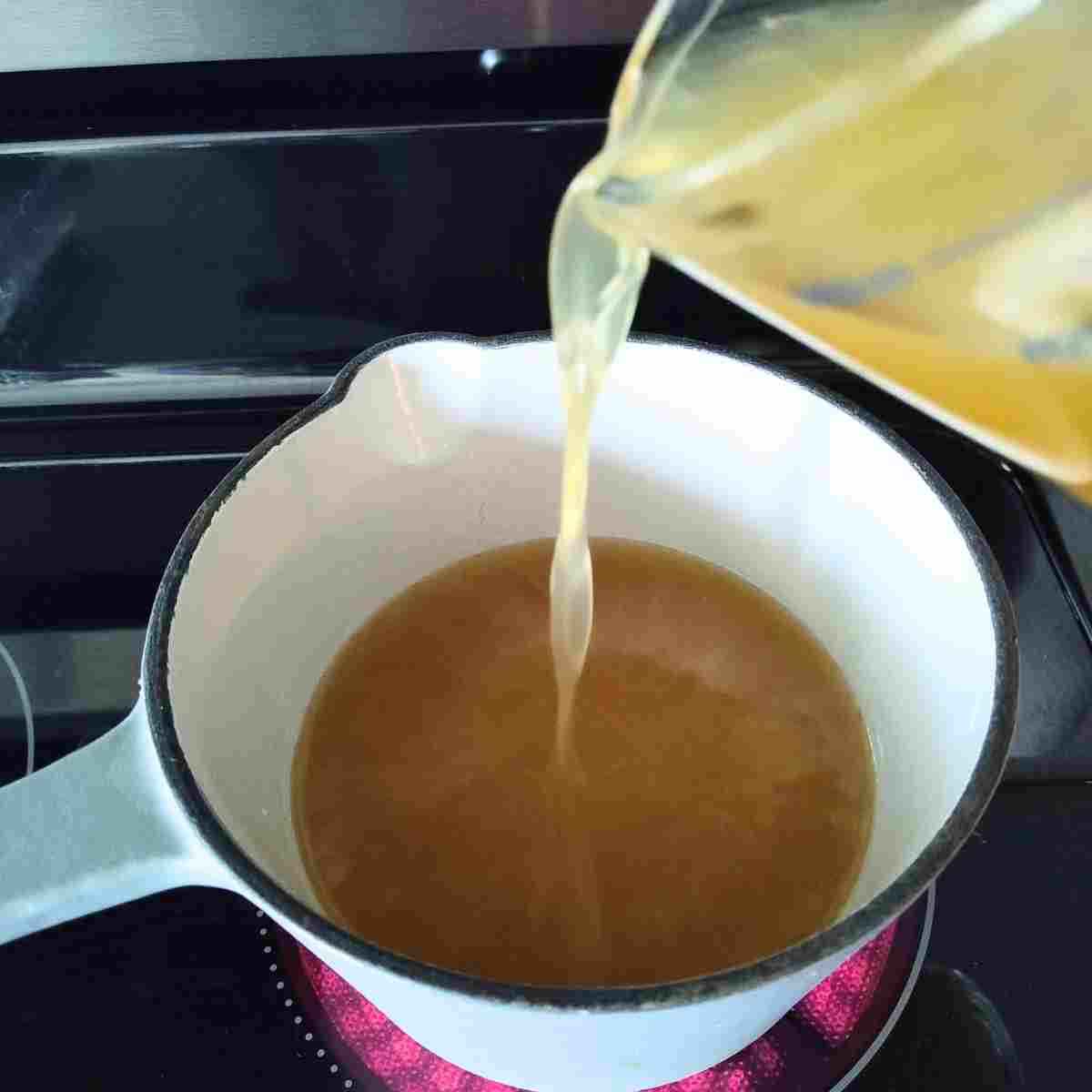 Warming the stock before adding it to the roux makes a smoother sauce without lumps.