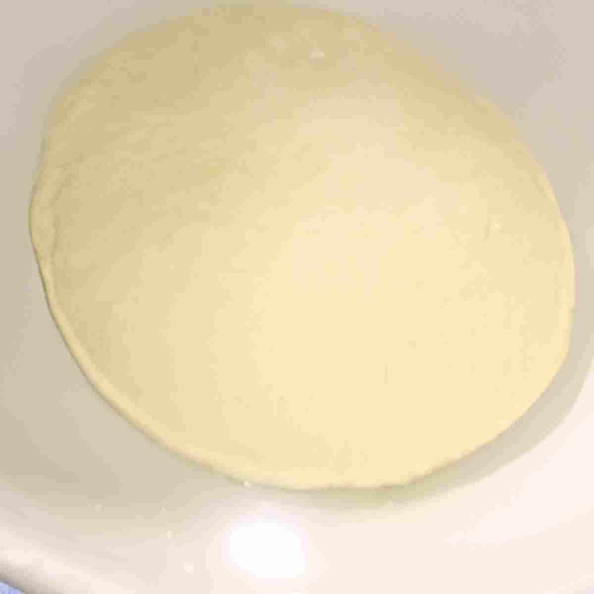 Second rising to triple size before shaping into loaves.