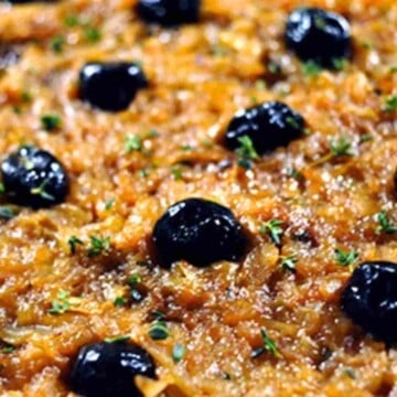 Pissaladiere is good pizza French style with caramelized onions and black olives.