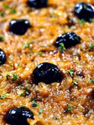 Pissaladiere is good pizza French style with caramelized onions and black olives.