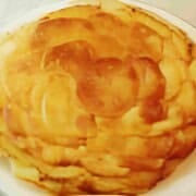 A classic French dish of sliced, layered potatoes cooked in lots butter.