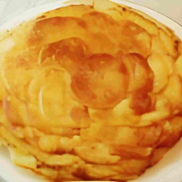 A classic French dish of sliced, layered potatoes cooked in lots butter.