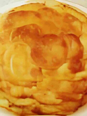 A classic French dish of sliced, layered potatoes cooked in lots butter.