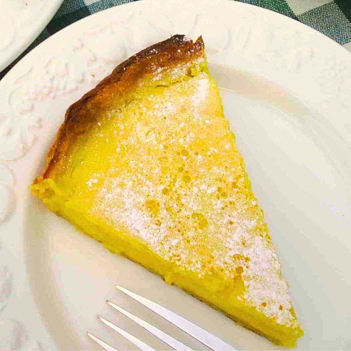 Easy lemon tart recipe with shortcrust pastry and fresh lemon custard filling.