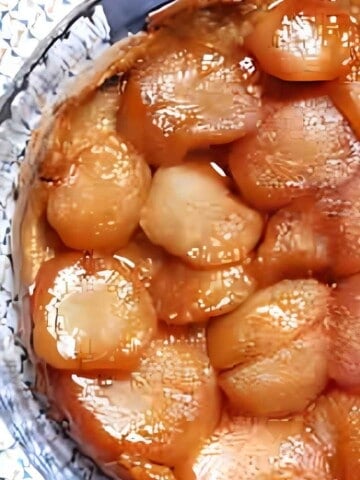 Baked apple dessert made with a pastry crust, apples, and a caramel topping.