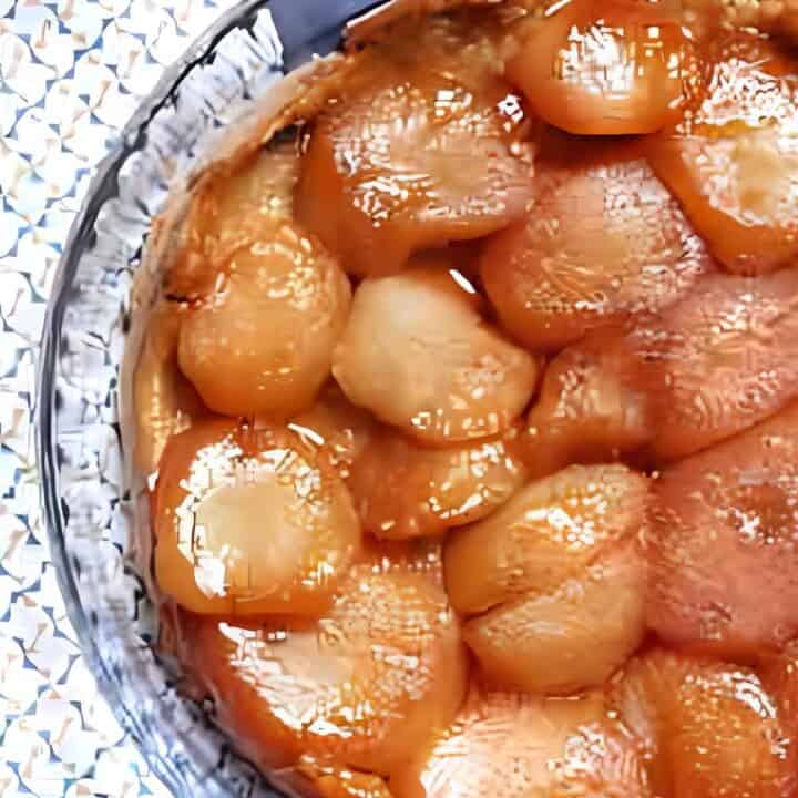 Baked apple dessert made with a pastry crust, apples, and a caramel topping.