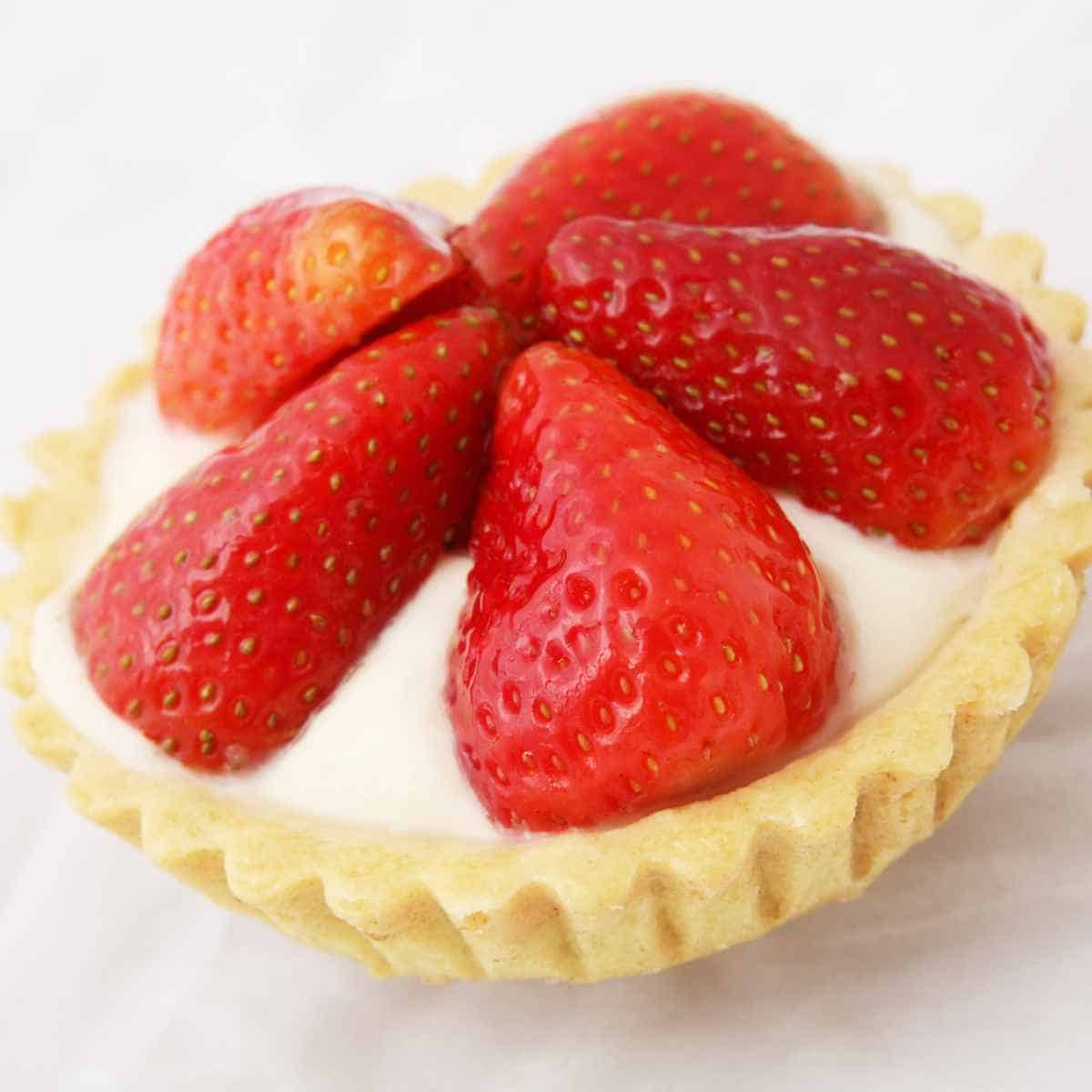 Strawberry tarts with orange cream cheese filling ready to eat.
