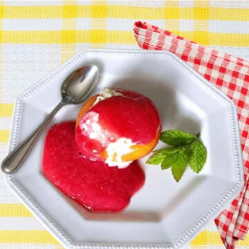 Poached Peach Melba is a French classic dessert with vanilla ice cream and raspberry sauce.