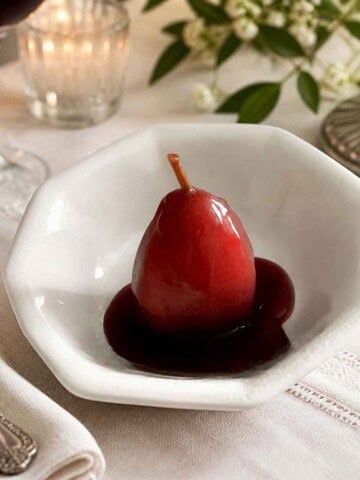 Pears poached in spicy red wine with orange and lemon zest.