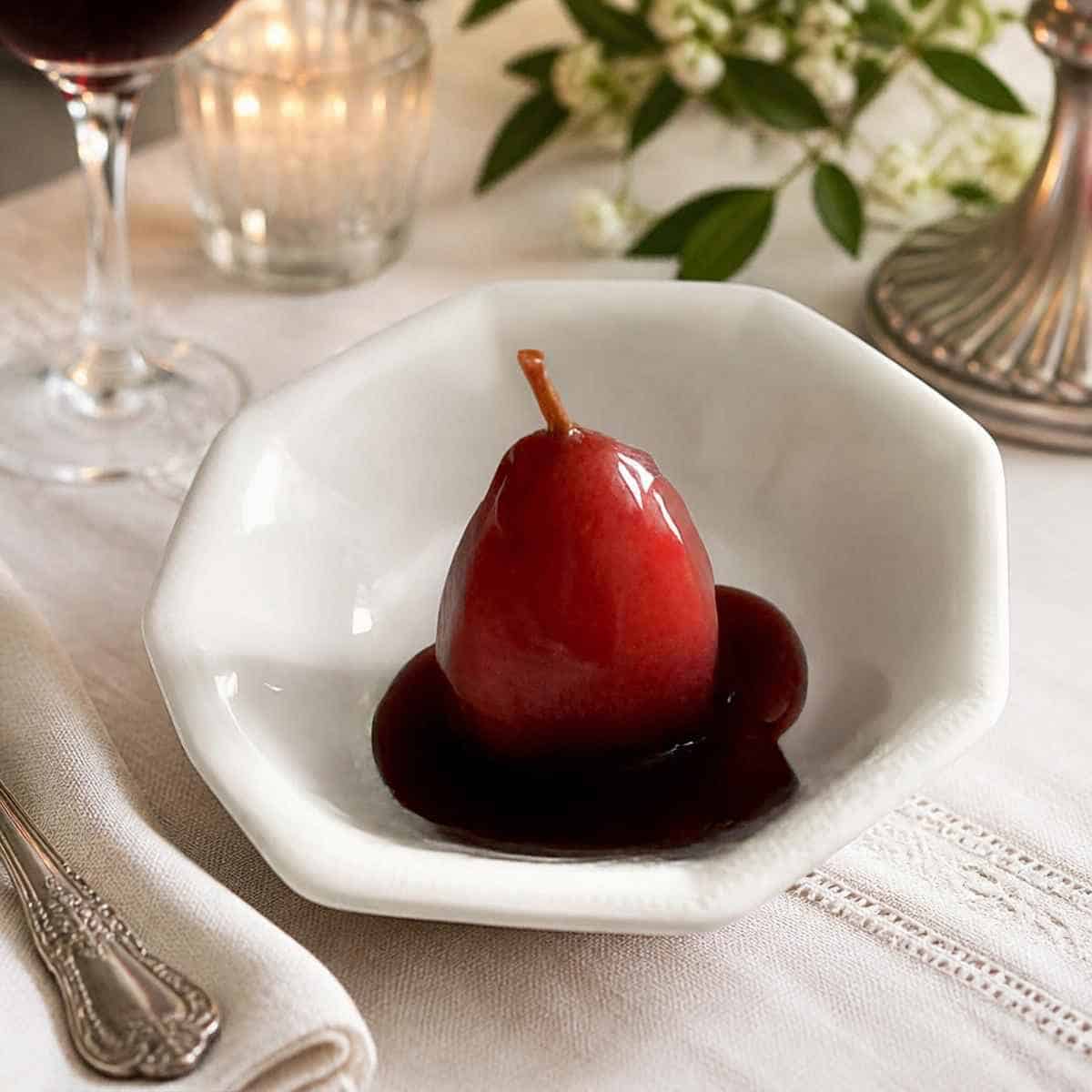 Pears poached in spicy red wine with orange and lemon zest.