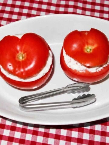 Seafood stuffed tomatoes for an appetizer table.