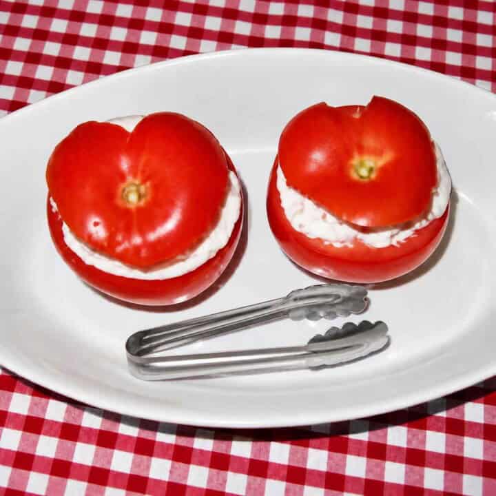 Seafood stuffed tomatoes for an appetizer table.